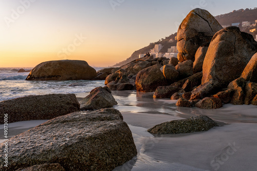Clifton 4th beach at sunset.  Beautiful tranquil beach in Cape Town, South Africa dotted with huge granitic boulders and super white sand.   photo