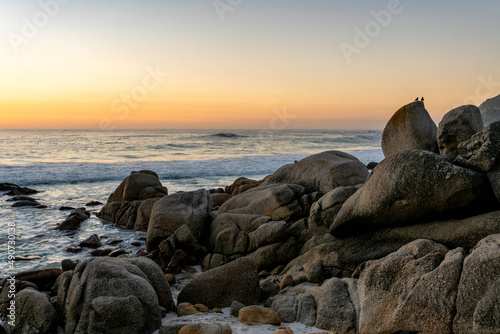 Clifton 4th beach at sunset.  Beautiful tranquil beach in Cape Town, South Africa dotted with huge granitic boulders and super white sand.  