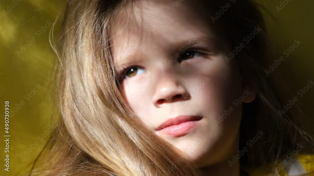 Portrait of beautiful sad little child girl . lonely child. Sunset light and shadow. Cinematic style Portrait of beautiful sad little child girl . lonely child. Sunset light and shadow. Cinematic style