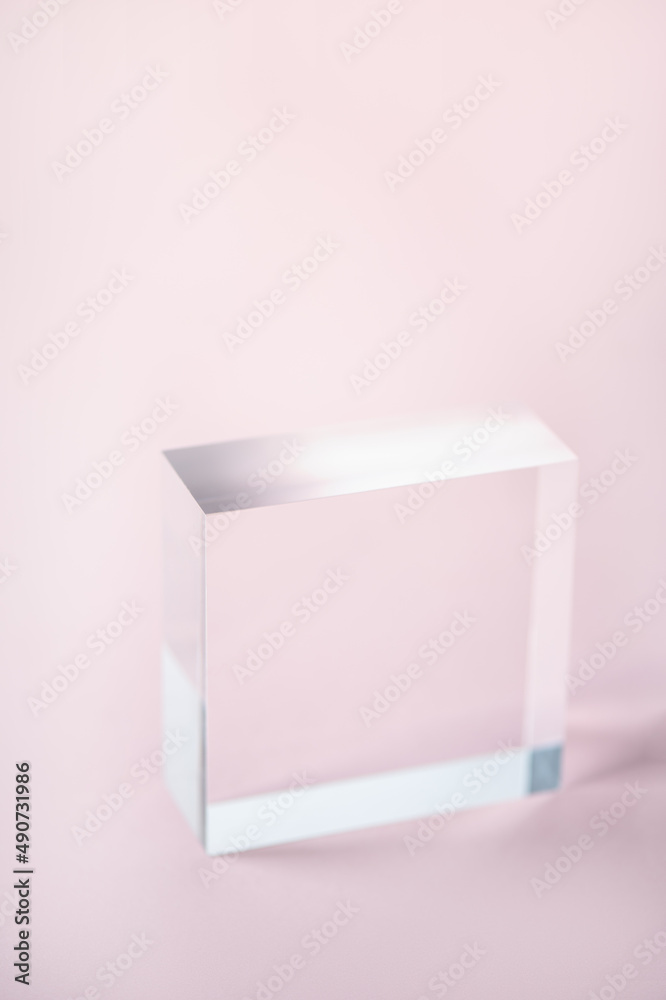 Acrylic Solid Display Block for Shop Windows on pink background, empty podium for product presentation, geometric stand for cosmetics Acrylic Solid Display Block for Shop Windows on pink background, empty podium for product presentation, geometric stand for cosmetics