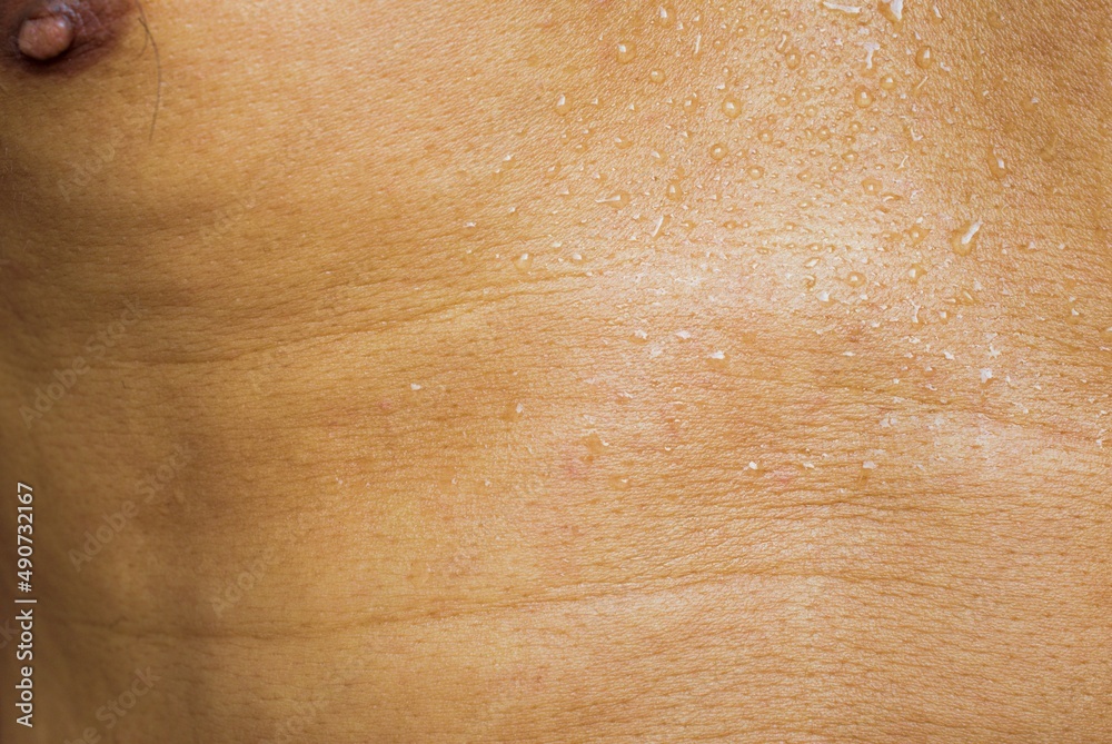 Fototapeta premium human skin water drop tan texture background