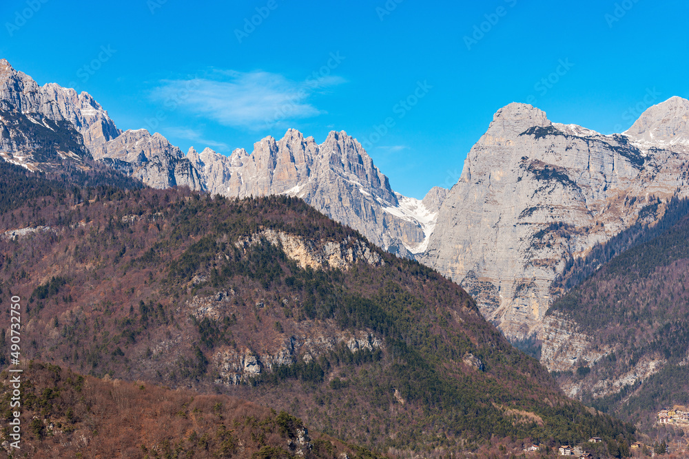 Mountain range and peak of Brenta Dolomites, National Park of Adamello Brenta view from Molveno lake in winter. UNESCO world heritage site, Trentino Alto Adige, Trento province, Italy, Europe.