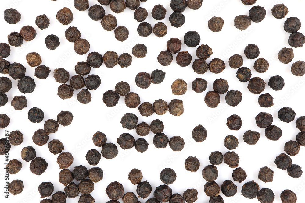 Obraz premium pile of black pepper seeds. isolated white background 