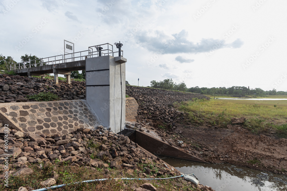A small dam floodgates as the water dries up.
