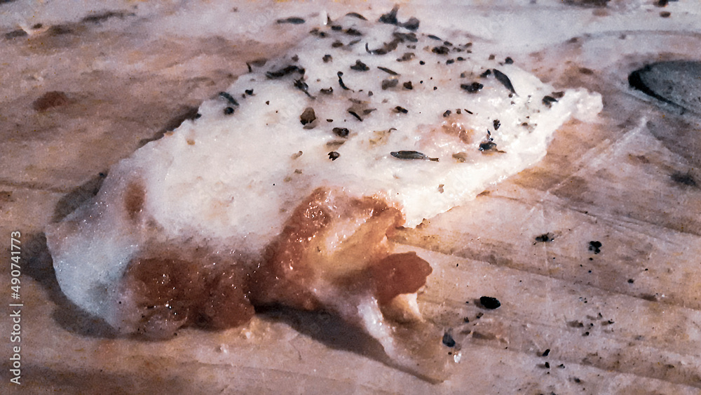 Fototapeta premium Piece of Pizza Over Wooden Table