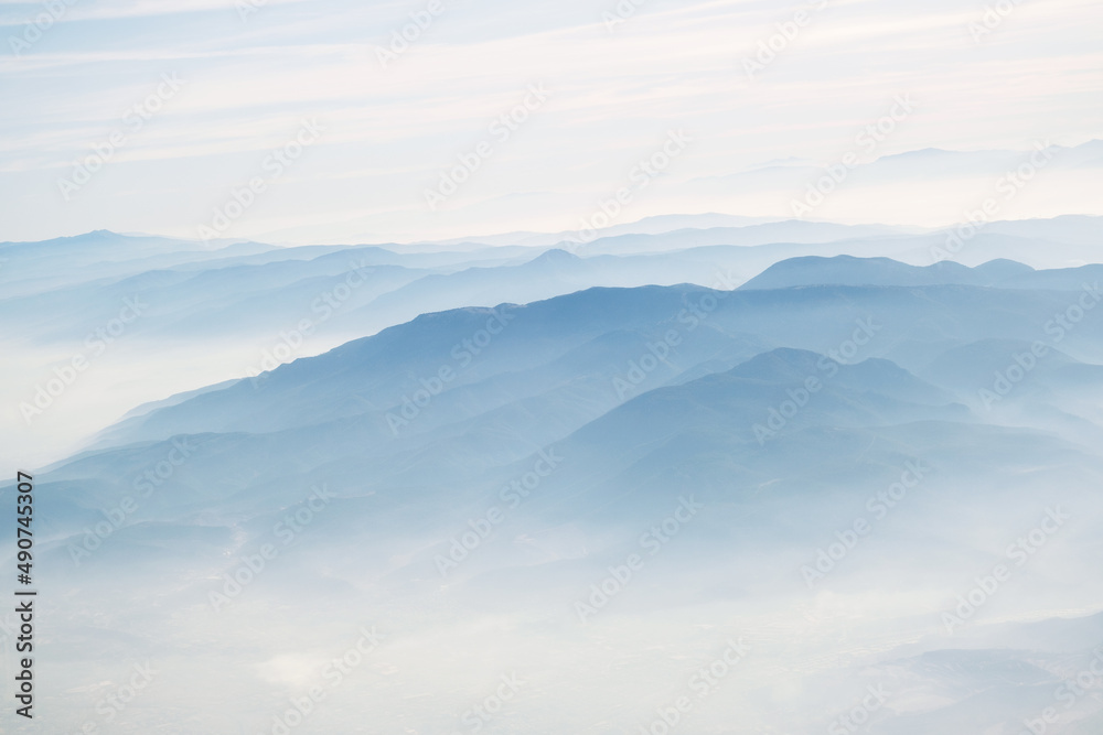 Fototapeta premium View of izmir's mountains in clouds from in airplane.
