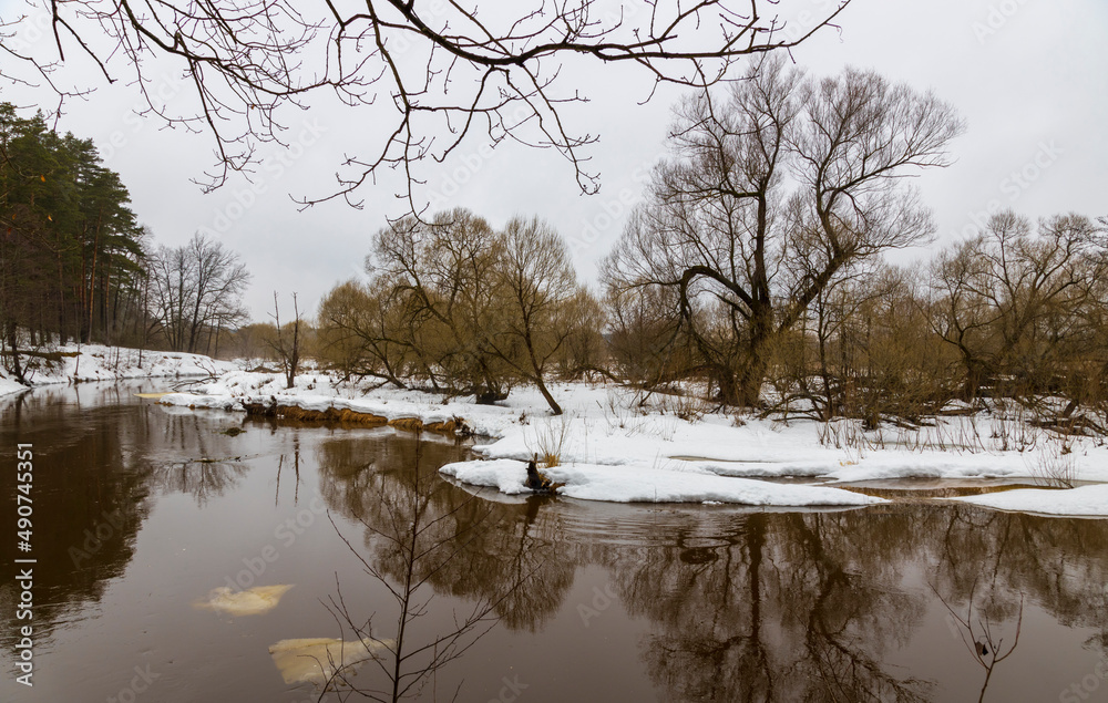 Spring landscape. River in early spring. Thaw. It's a nasty day Spring landscape. River in early spring. Thaw. It's a nasty day