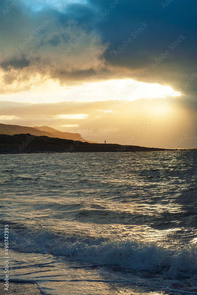 Fototapeta premium Beautiful dramatic blue sea waves and gloomy sky