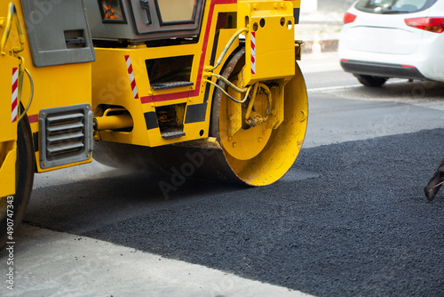 Steamroller flatten out the asphalt