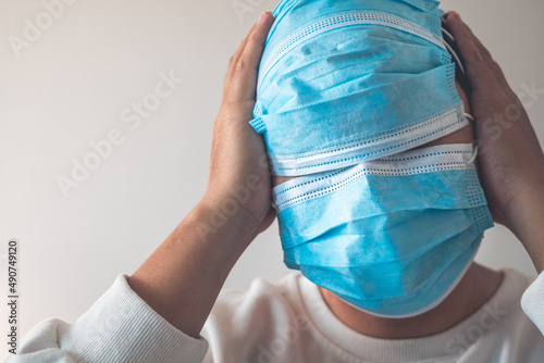Medical masks wearing in correct way. But he uses them redundantly. Protection global pandemic of coronavirus. Other name of this disease calls COVID-19. Copy space for text.