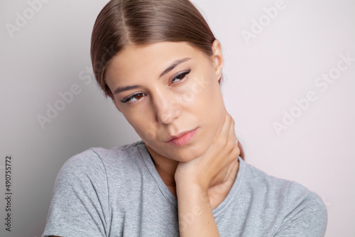 Beautiful Young Woman Suffering From Neck Pain