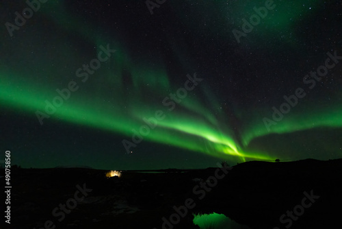 Aurora borealis with stars and lake reflections © F.C.G.