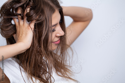 Happy young woman with wet hair in bathroom