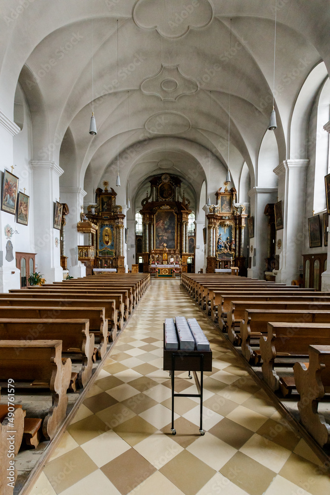 Empty church interior with wooden pews