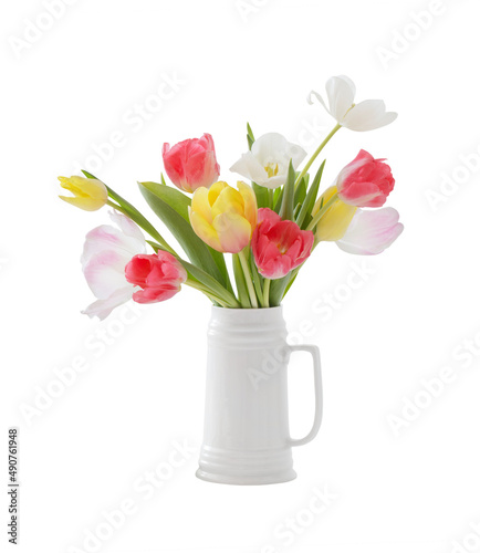beautiful tulips in white jug isolated on white background
