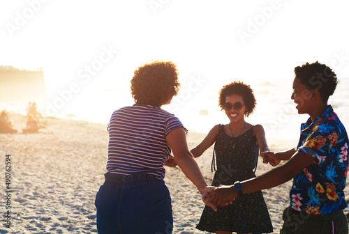 Friends make the world a better place. Cropped shot of an attractive young trio of women enjoying a day out together on the beach during the day.