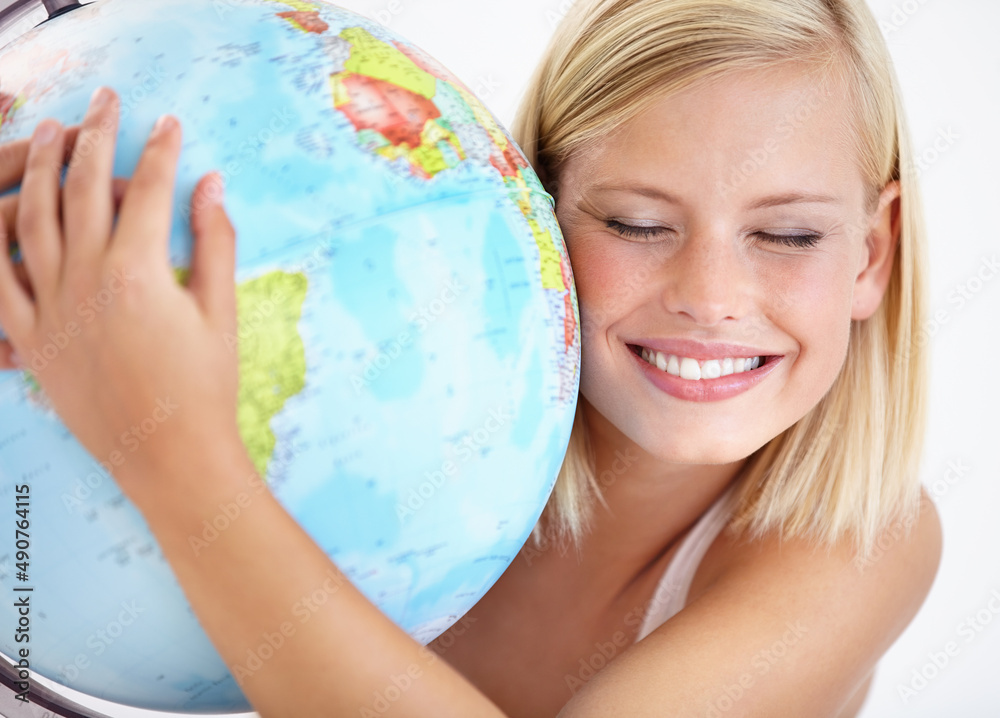Our planet is amazing. A pretty young woman hugging a globe of the earth. Our planet is amazing. A pretty young woman hugging a globe of the earth.
