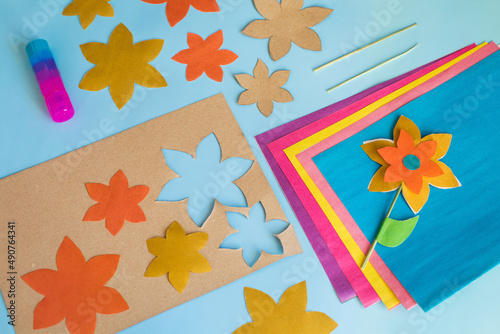 Handmade flowers from multi-colored paper for mother's day, women's day on March 8, birthday. Step by step instructions - step 4. Children's master class. Creativity and leisure of the child.
