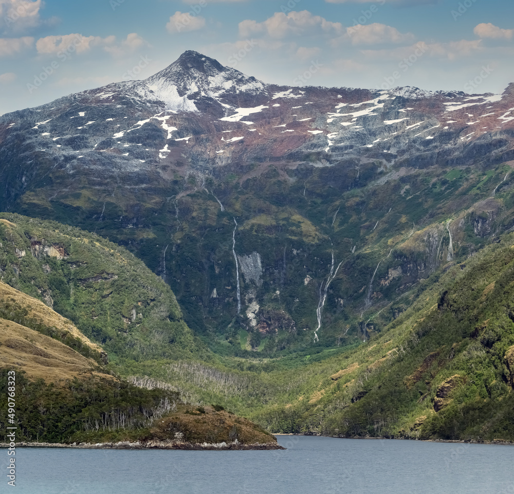 Stunning glaciers and waterfalls along the Beagle Channel, a strait in the Tierra del Fuego Archipelago, on the southern tip of South America between Chile and Argentina.