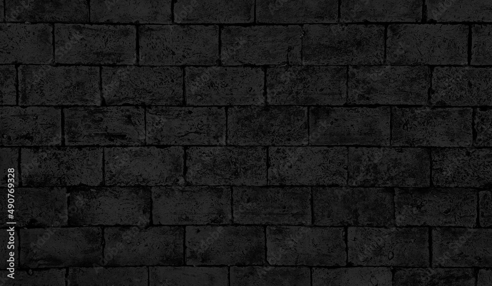 old dark black dirt brick floor, aged wall brick, weathered brick ground with grunge textured. floor background. beautiful horizontal texture of part of an old dark grey crushed brick wall.