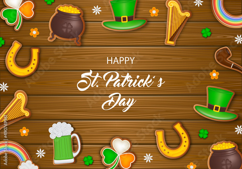 Saint patrick day poster with gingerbread cookies on wooden background