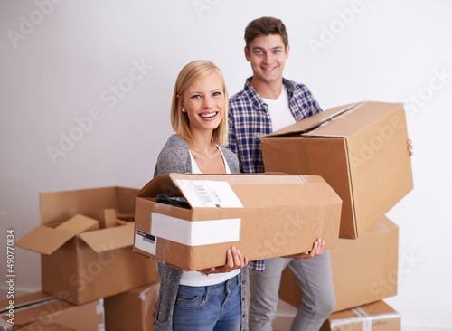 So glad we made the move. Shot of a happy young couple on their moving in day.