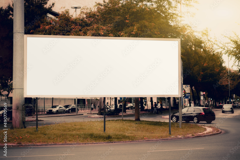 A huge rectangular white empty advertising billboard template on the beltway; a mock-up of a blank advert poster placeholder in the roundabout; a mockup of an urban ad banner near the road with cars