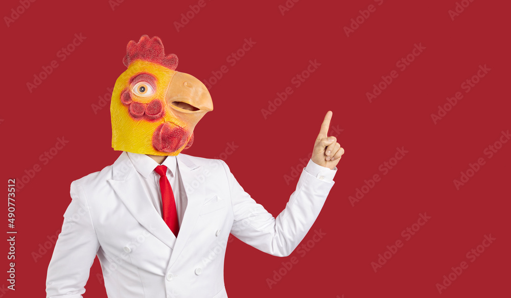 Crazy man wearing white suit and funny chicken rooster mask standing ...