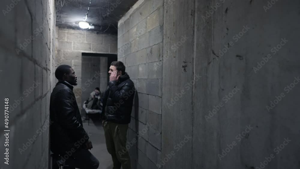 View of a basement with people hiding during bombardment View of a basement with people hiding during bombardment