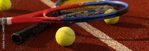 Tennis game. Tennis ball with racket on the tennis court. Sport, recreation concept. © Angelov