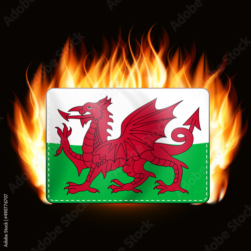 Concept Wales flag on fire background. Country emblem. Illustration