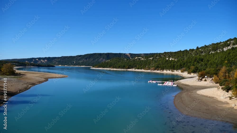 Reservoir Lake of Sainte-Croix near the western edge of Verdon Gorge in Provence region, southern France on sunny day in autumn with boats. Reservoir Lake of Sainte-Croix near the western edge of Verdon Gorge in Provence region, southern France on sunny day in autumn with boats.