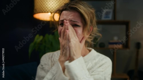 Crying woman shouting, portrait of screaming female person in living room, feeling anger and stress, bad mood. Family problems, aggressive emotional wife quarreling. 