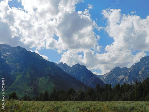Clouds hover and dance over the Grand Tetons in Wyoming
