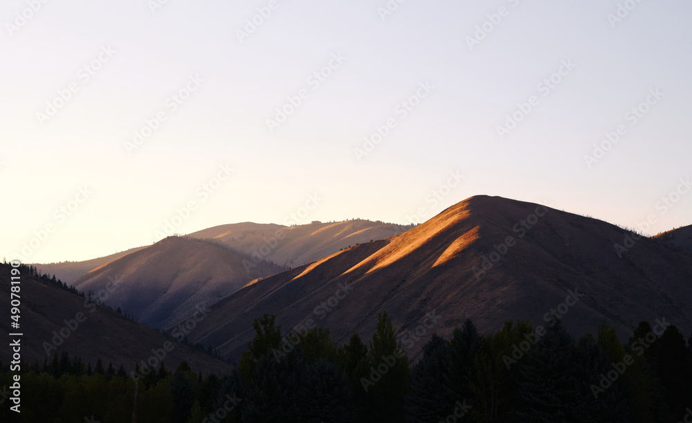 Sunset light shining on mountains in Sunny Valley, Idaho