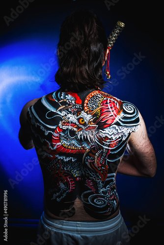 yakuza with dragon tattoo on back