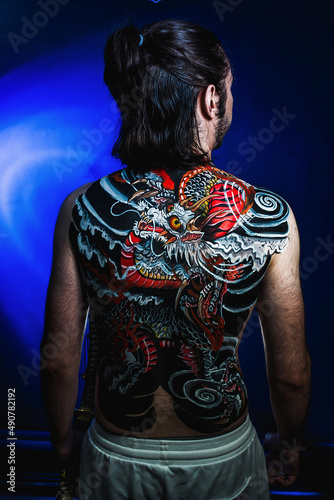 yakuza with dragon tattoo on back © Наталья Новикова