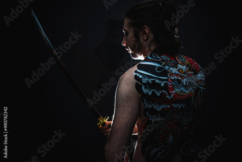yakuza with dragon tattoo on back