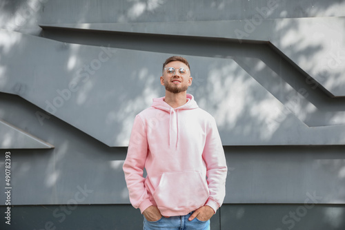 Young guy in stylish hoodie...