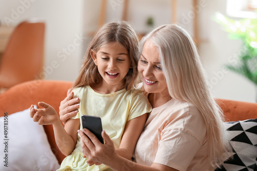 Little girl with her grandm...