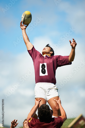 The freedom of doing what you love. Shot of a young rugby player catching the ball during a lineout.
