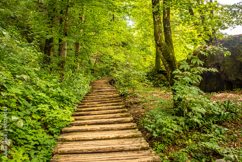 wooden footpath of Plitvice Lakes National Park, UNESCO world natural heritage and famous tourist destination in Croatia.