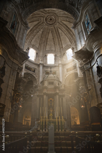 interior of the cathedral of Cadiz with sunbeams entering through the windows