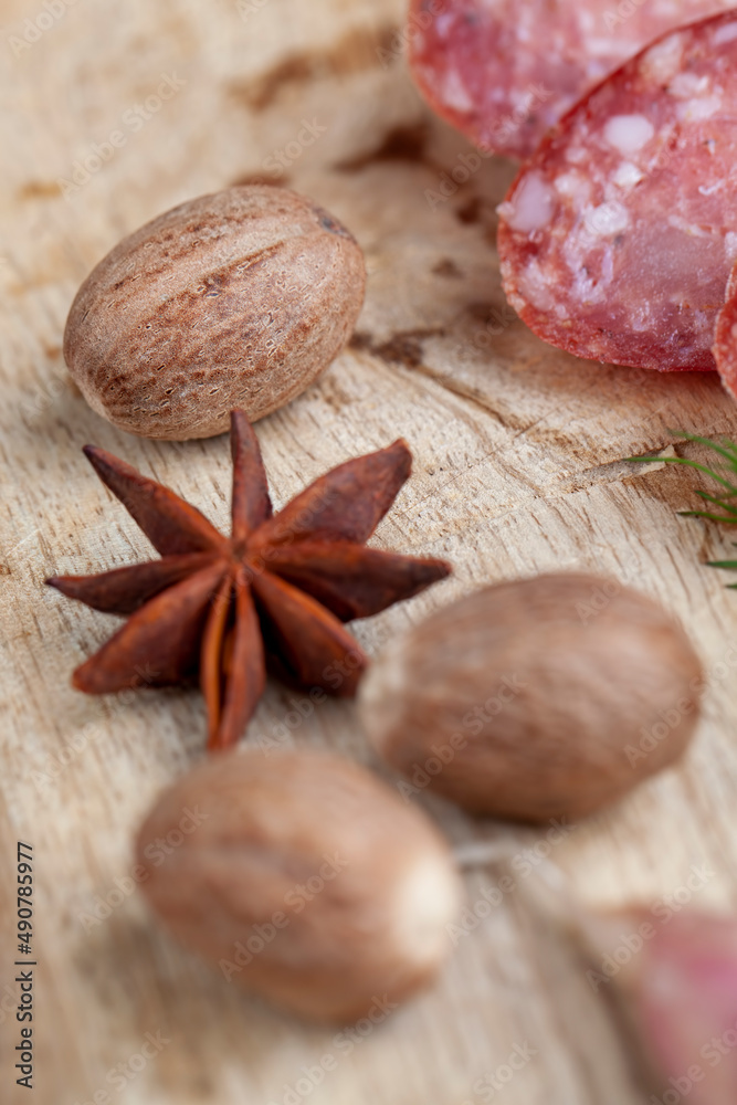 a whole nutmeg on a wooden board a whole nutmeg on a wooden board
