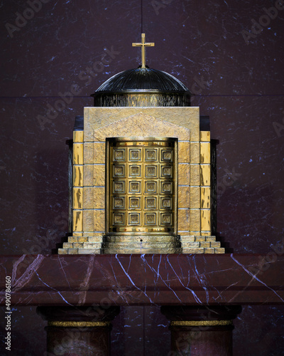 Close up of a brass tabernacle in the Co-Cathedral of the Sacred Heart Catholic church in downtown Houston, Texas photo