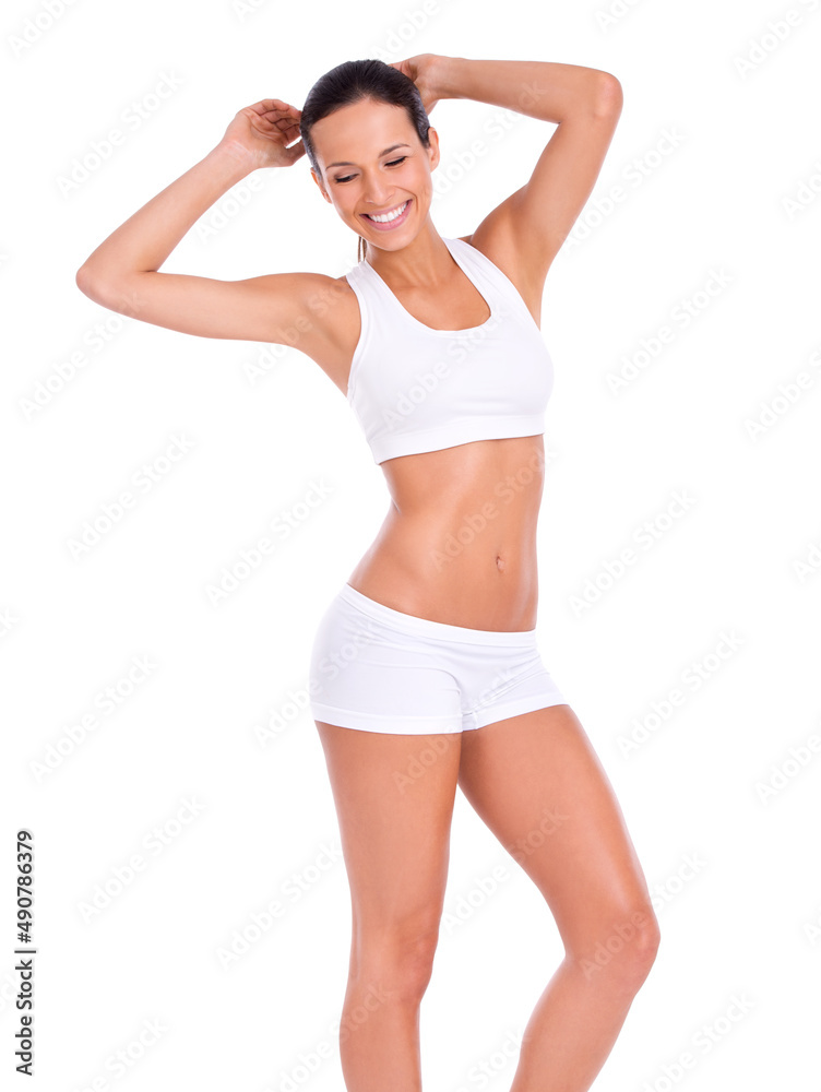 Feeling fit and awesome. Studio portraitt of a fit young woman isolated on white. Feeling fit and awesome. Studio portraitt of a fit young woman isolated on white.
