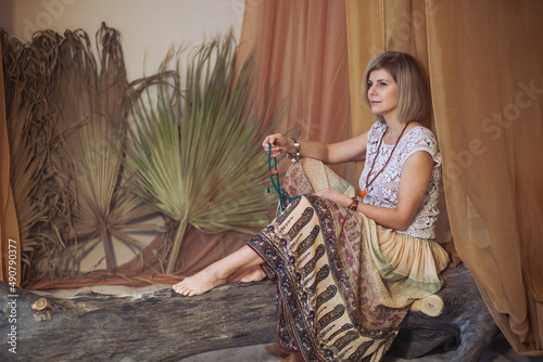 The concept of zen, peace, balance. A woman sits and meditates  using Mudra, keeping her legs crossed