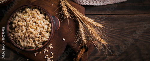 Bowl of cooked peeled barley grains porridge