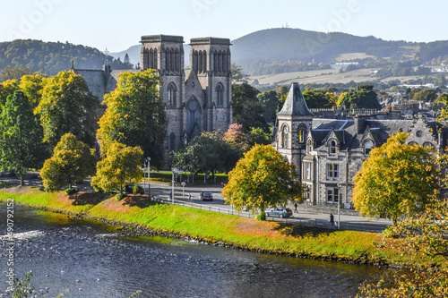 Fényképezés Beautiful shot of buildings and landscapes along the river Ness in Inverness, Sc