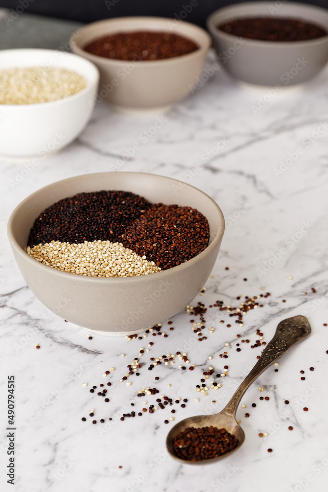 Quinoa of different colors: white, red and black in a bowl. Healthly gluten free grains. Quinoa of different colors: white, red and black in a bowl. Healthly gluten free grains.